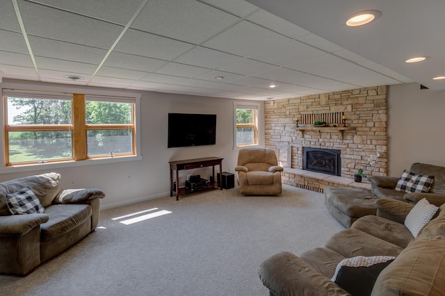 20428 Pheasant Trl, Brainerd, MN 56401 - carpeted living area with a drop ceiling, healthy amount of natural light, and a stone fireplace