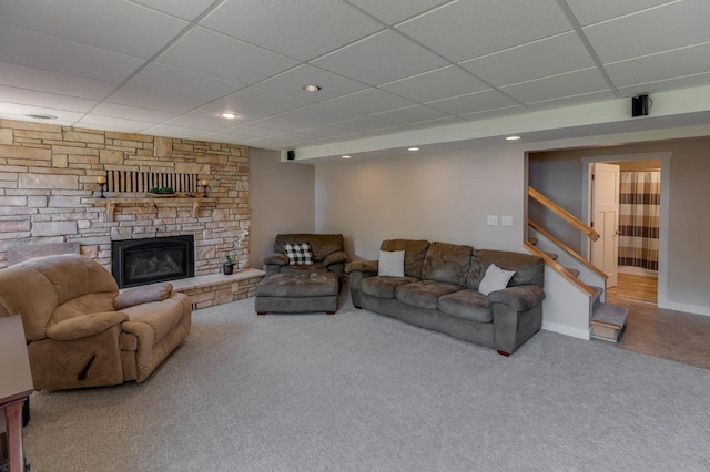 20428 Pheasant Trl, Brainerd, MN 56401 - carpeted living area featuring a drop ceiling, stairway, a fireplace, and recessed lighting