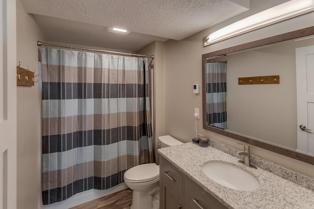 20428 Pheasant Trl, Brainerd, MN 56401 - full bathroom with vanity, a textured ceiling, wood finished floors, and a shower with curtain