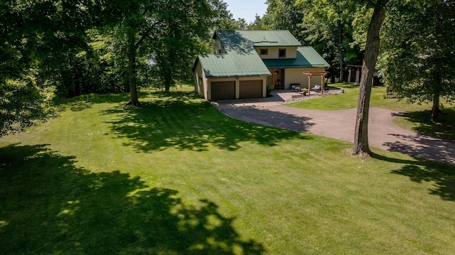 20428 Pheasant Trl, Brainerd, MN 56401 - view of grassy yard featuring asphalt driveway and an attached garage