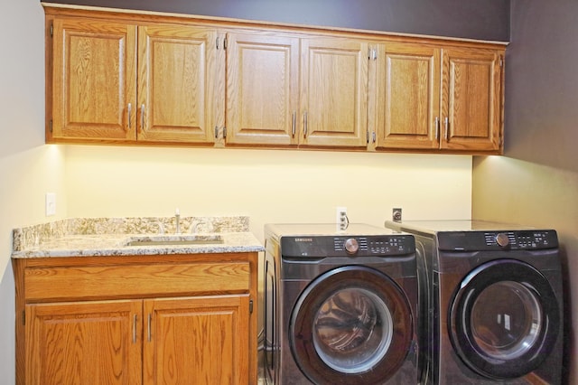 13334 Silverod Ct NW, Andover, MN 55304 - laundry area featuring cabinet space and washing machine and clothes dryer