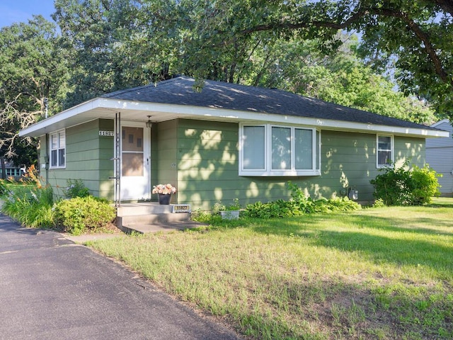 11827 Douglas Dr N, Champlin, MN 55316 - ranch-style house featuring a front yard and roof with shingles
