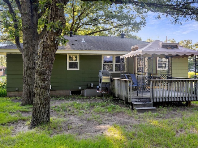 11827 Douglas Dr N, Champlin, MN 55316 - back of house with a wooden deck and a shingled roof