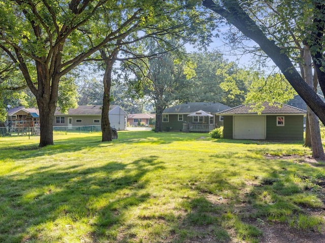 11827 Douglas Dr N, Champlin, MN 55316 - view of yard featuring an outbuilding and a garage