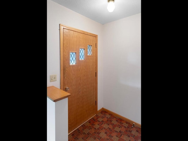11827 Douglas Dr N, Champlin, MN 55316 - entryway with baseboards and brick patterned flooring