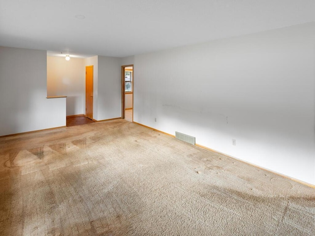 11827 Douglas Dr N, Champlin, MN 55316 - carpeted empty room with baseboards