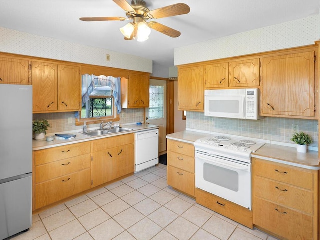 11827 Douglas Dr N, Champlin, MN 55316 - kitchen with white appliances, wallpapered walls, tasteful backsplash, light countertops, and ceiling fan