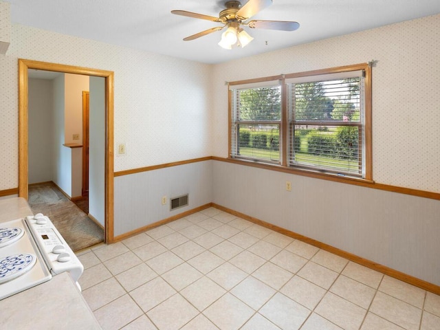 11827 Douglas Dr N, Champlin, MN 55316 - spare room featuring a ceiling fan and wallpapered walls