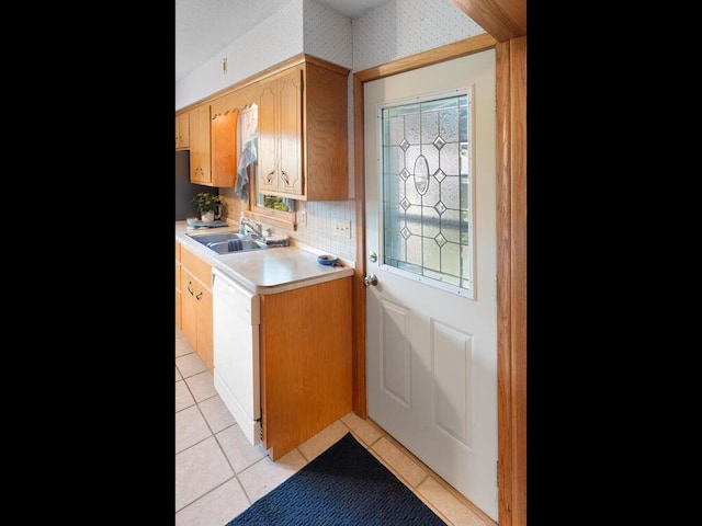 11827 Douglas Dr N, Champlin, MN 55316 - kitchen with light tile patterned flooring, dishwasher, light countertops, and wallpapered walls