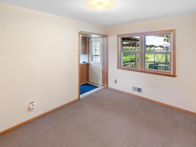 11827 Douglas Dr N, Champlin, MN 55316 - carpeted empty room featuring baseboards