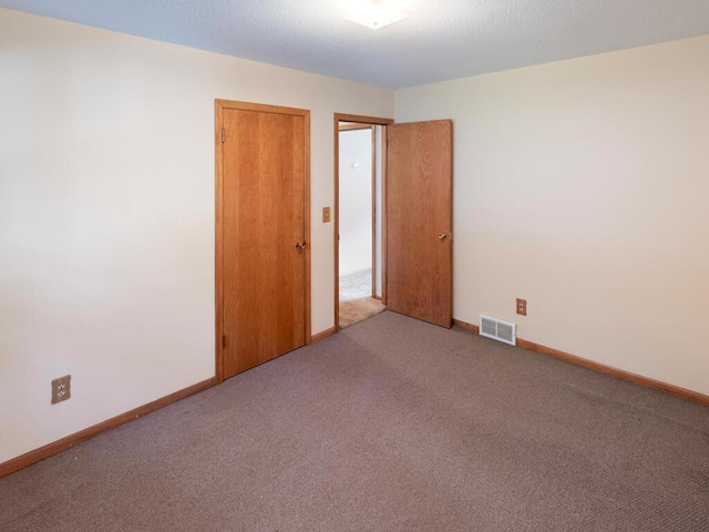 11827 Douglas Dr N, Champlin, MN 55316 - carpeted empty room with baseboards
