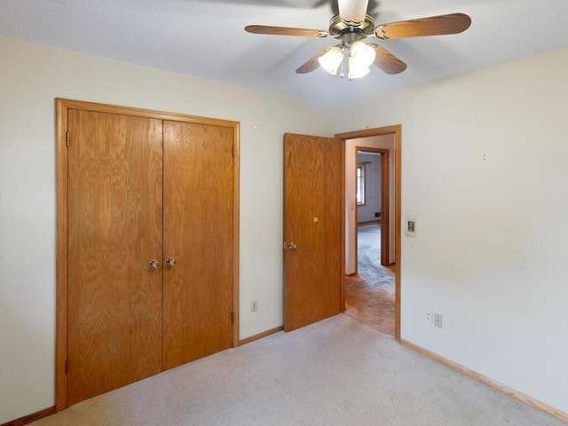 11827 Douglas Dr N, Champlin, MN 55316 - unfurnished bedroom with carpet, a closet, and ceiling fan