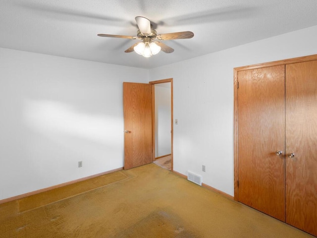 11827 Douglas Dr N, Champlin, MN 55316 - unfurnished bedroom featuring carpet floors, a closet, and ceiling fan