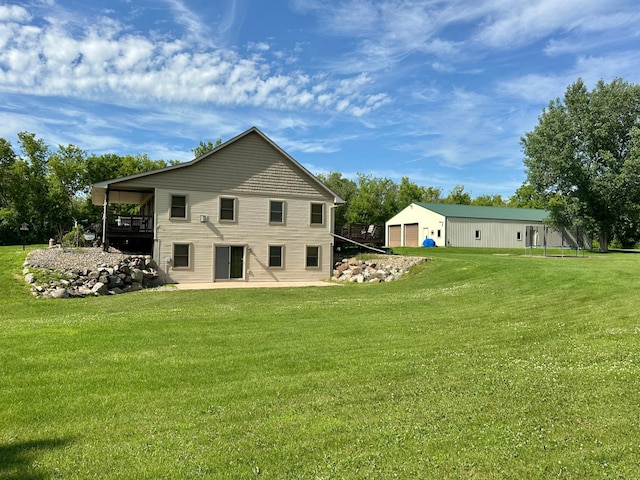 2161 170th St, New Richmond, WI 54017 - back of property featuring a garage and a lawn