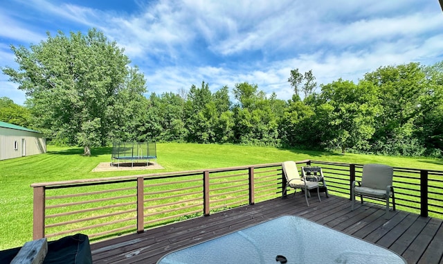 2161 170th St, New Richmond, WI 54017 - wooden deck featuring a trampoline and a lawn
