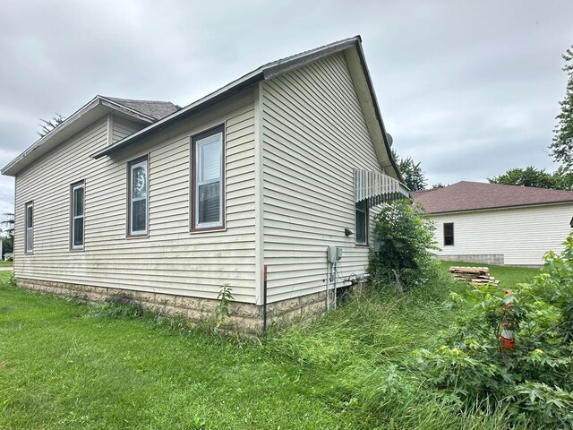 203 4th St, Beaver Creek, MN 56116 - view of home's exterior featuring a lawn