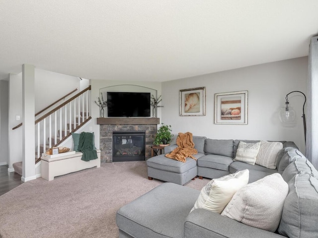 910 Burton Cir, Montrose, MN 55363 - carpeted living area with stairway and a stone fireplace