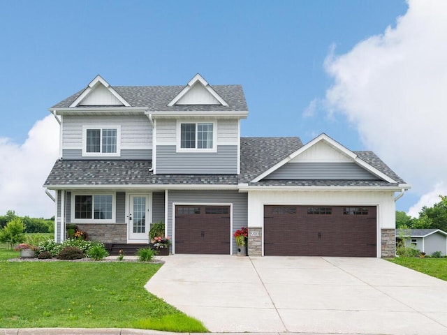 910 Burton Cir, Montrose, MN 55363 - craftsman-style house with driveway, a front lawn, stone siding, an attached garage, and roof with shingles