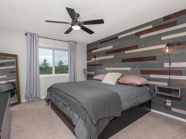 910 Burton Cir, Montrose, MN 55363 - bedroom with wood walls, carpet flooring, ceiling fan, and a textured ceiling