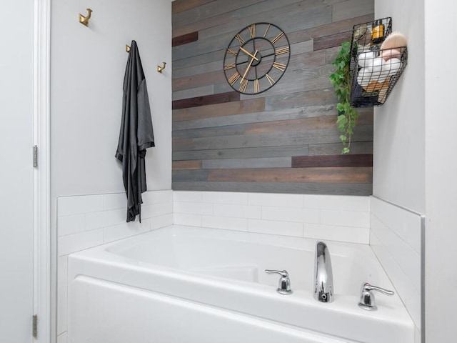 910 Burton Cir, Montrose, MN 55363 - bathroom featuring a garden tub and wooden walls