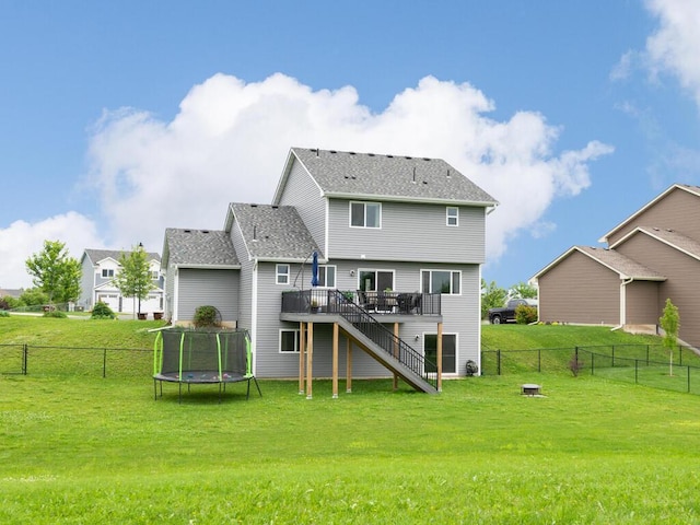 910 Burton Cir, Montrose, MN 55363 - rear view of house with a deck, a trampoline, stairs, and a fenced backyard