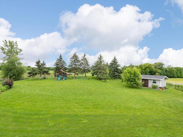 910 Burton Cir, Montrose, MN 55363 - view of yard with a playground and an outbuilding