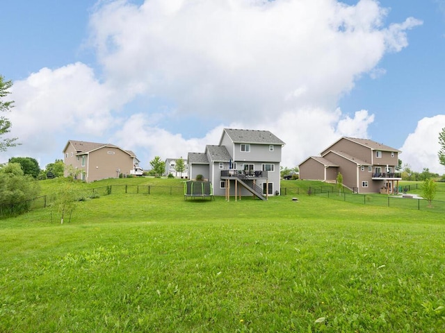 910 Burton Cir, Montrose, MN 55363 - back of property with a fenced backyard, stairway, a wooden deck, and a residential view
