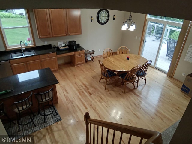 6640 Fountain Ct N, Maple Grove, MN 55311 - dining room with light wood-style flooring and a chandelier