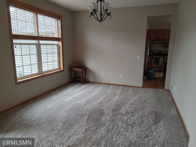 6640 Fountain Ct N, Maple Grove, MN 55311 - unfurnished room with carpet flooring and a chandelier