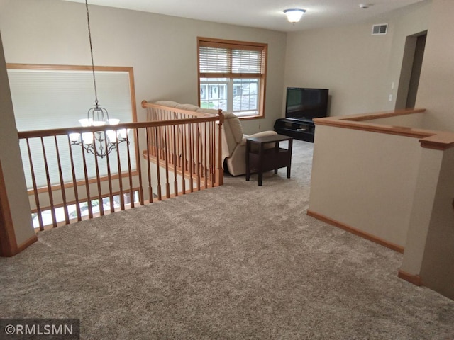 6640 Fountain Ct N, Maple Grove, MN 55311 - hallway with carpet floors and a chandelier