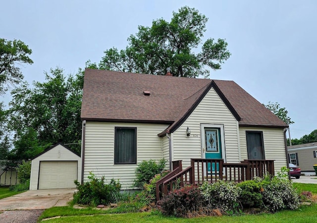 808 5th St SW, Pipestone, MN 56164 - view of front of home with an outbuilding, a garage, roof with shingles, and concrete driveway