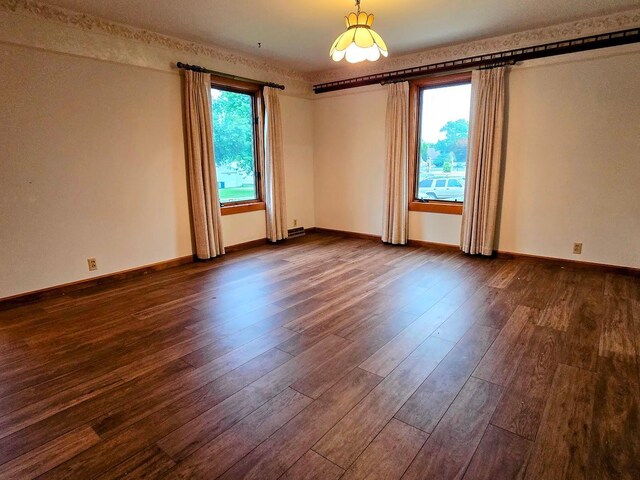 808 5th St SW, Pipestone, MN 56164 - unfurnished room featuring dark wood-style flooring and baseboards