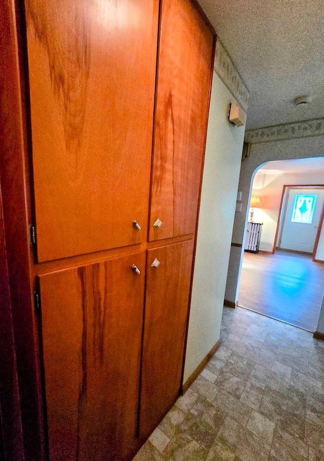 808 5th St SW, Pipestone, MN 56164 - hallway with arched walkways and tile patterned floors