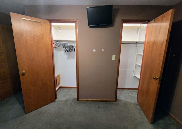 808 5th St SW, Pipestone, MN 56164 - unfurnished bedroom featuring a spacious closet, a closet, and carpet flooring