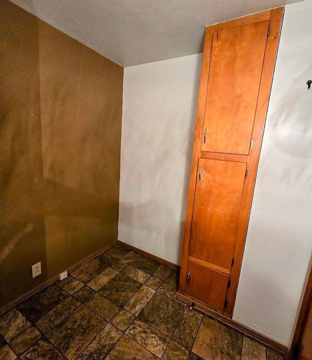 808 5th St SW, Pipestone, MN 56164 - detailed view of baseboards and a textured ceiling