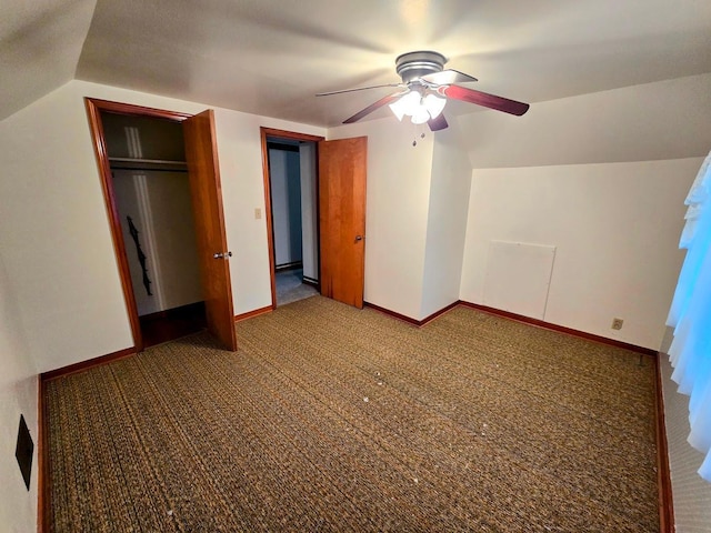 808 5th St SW, Pipestone, MN 56164 - unfurnished bedroom with carpet floors, vaulted ceiling, a ceiling fan, and a closet