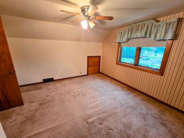 808 5th St SW, Pipestone, MN 56164 - additional living space featuring carpet floors, vaulted ceiling, and ceiling fan