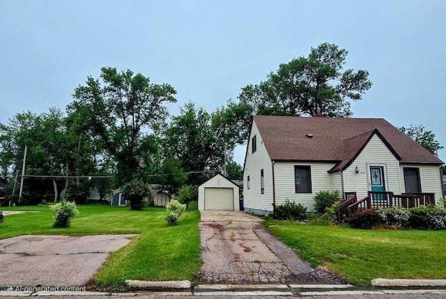 808 5th St SW, Pipestone, MN 56164 - view of front of property with an outbuilding, a detached garage, a front lawn, and a shingled roof