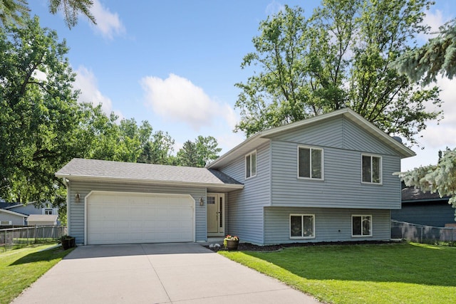 6520 Nathan Ln N, Maple Grove, MN 55369 - tri-level home with driveway and a garage