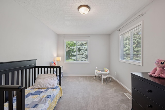 6520 Nathan Ln N, Maple Grove, MN 55369 - carpeted bedroom featuring a textured ceiling and baseboards