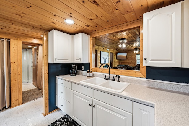 51122 Long Point Pl, Mcgregor, MN 55760 - kitchen with wood ceiling, white cabinetry, light floors, light countertops, and ceiling fan