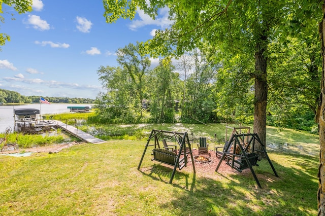 51122 Long Point Pl, Mcgregor, MN 55760 - view of green lawn with a water view, a dock, and an outdoor fire pit