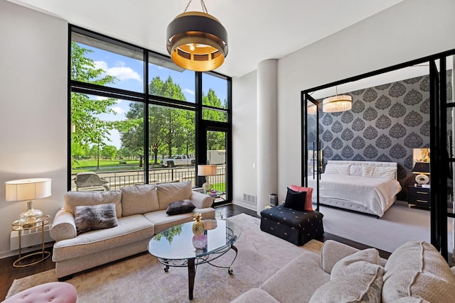 215 10th Ave S Unit 112, Minneapolis, MN 55415 - living room with wood finished floors and a wall of windows