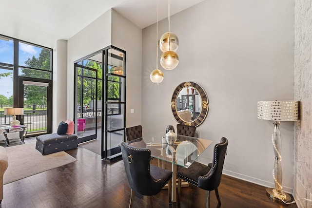 215 10th Ave S Unit 112, Minneapolis, MN 55415 - dining room featuring wood finished floors and baseboards