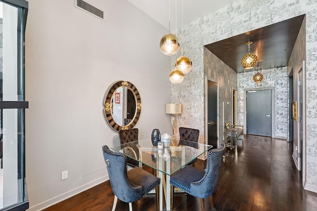 215 10th Ave S Unit 112, Minneapolis, MN 55415 - dining area featuring wallpapered walls and wood finished floors