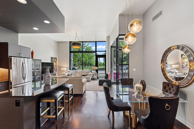 215 10th Ave S Unit 112, Minneapolis, MN 55415 - dining area with floor to ceiling windows, dark wood-style floors, and recessed lighting