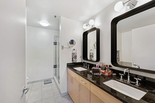 215 10th Ave S Unit 112, Minneapolis, MN 55415 - full bathroom with a shower stall, double vanity, and tile patterned flooring