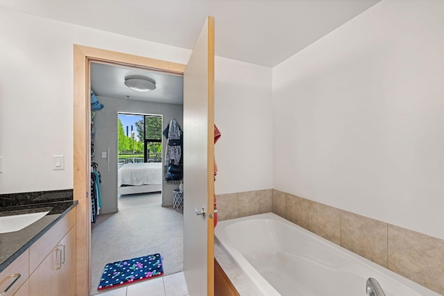 215 10th Ave S Unit 112, Minneapolis, MN 55415 - full bathroom featuring ensuite bath, a bath, vanity, and tile patterned flooring