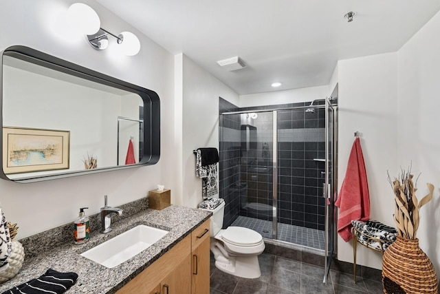 215 10th Ave S Unit 112, Minneapolis, MN 55415 - bathroom featuring vanity, a shower stall, and tile patterned floors