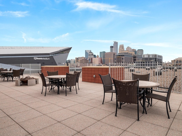 215 10th Ave S Unit 112, Minneapolis, MN 55415 - view of patio / terrace with outdoor dining space and a view of skyline